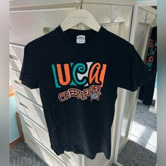 Uca Universal Cheerleading Association Cheerleader T-Shirt Tee Shirt 100% Cotton By Varsity Cheersize Small! Brand New! Bought From A Camp As A Camper Years Ago!! Now As A Uca Camp Staffer I’m Letting A Bunch Of Cheer Things Go!! Check Out The Rest Of My Closet!! Uca Camp, Cheer Camp Shirts, Varsity Top, Cheer Tops, Cheer Things, Varsity Cheer, Cheer Tshirts, Cheer Camp, University Shirt