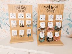 two display boards with earring holders on them