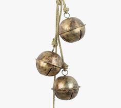 two metal balls hanging from a rope