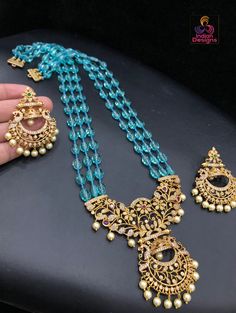 High quality semiprecious color beaded necklace 20 inch length with awesome traditional temple design floral pendant studded with CZ ad stones and emerald ruby stones. The pendant set comes with matching pair of earrings. Color Beaded Necklace, Bangle Ring, Temple Design, Floral Pendant, Kundan Necklaces, Cz Jewelry, Ruby Stone, American Diamond, Design Floral