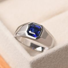 This ring features a 6*6mm asscher cut lab sapphire and sterling silver finished with rhodium. Customization is available. It is made by hand, and it will take about 7 days to finish the ring after your payment is completed. It include the lab emerald ring and the band. Main stone: lab sapphire Main stone weight: Approx 1.49 ct Metal type: sterling silver finished with rhodium/14k white gold/14k rose gold/14k yellow gold Accent stone: none Customization is available, I also can make it with 14k Men’s Sapphire Ring, Mens Sapphire Ring, Sapphire Anniversary Ring, Sapphire Anniversary, Swiss Blue Topaz Ring, September Birthstone Rings, London Blue Topaz Ring, Engagement Ring Cuts, Lovely Ring