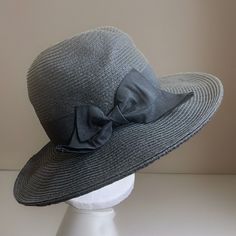 Get Ready For Your Next Beach Or Pool Day With This Nine West Women's Black Woven Wide Brim Hat. This Stylish Hat Is Perfect For Any Casual Occasion And Is Made Of High-Quality Straw Material That Provides Upf Protection. The Hat Is One Size Fits All, Making It A Great Gift Option For Any Woman Who Loves Classic Style And Beach Themes. With Its Packable Design, This Nine West Hat Is Perfect For Travel And Can Be Easily Stored In Your Luggage. Let Us Know If You Have Any Questions, We Are Always Black Lightweight Bucket Sun Hat, Lightweight Black Bucket Sun Hat, Lightweight Black Hat For Beach, Black Lightweight Casual Sun Hat, Lightweight Black Casual Sun Hat, Black Straw Hat With Curved Brim For Outdoor, Black Curved Brim Straw Hat For Outdoor, Black Fedora Sun Hat, One Size Fits Most, Black Straw Hat For Spring Outdoor