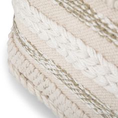 a white knitted pillow on a white background