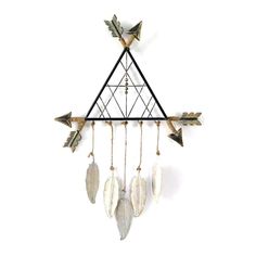 a metal triangle with feathers hanging from it's sides and an arrow on top