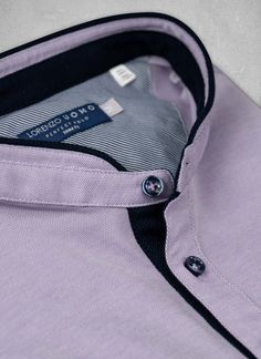 From our Perfect Polo Collection.  Inspired by the effortless style worn in Como, our Ultra-Luxurious Perfect Polo Shirt in Lavender is meticulously crafted from the finest mercerized cotton and breathable technical fibers in the world.  The mercerization process adds ultra-smoothness and softness, and the result is the most luxurious polo shirt, engineered to keep you cool all day long.  We have added bespoke design elements such as a subtle summer white contrast fabric on the inside, complimen Casual Purple Collared Top, Purple Fitted Cotton Shirt, Purple Fitted Collar Top, Fitted Cotton Lavender Tops, Fitted Lavender Cotton Tops, Classic Purple Crew Neck Top, Purple Short Sleeve Shirt For Work, Purple Short Sleeve Work Shirt, Classic Purple Cotton Tops