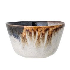 a black and white bowl with brown streaks on the rim, sitting in front of a white background