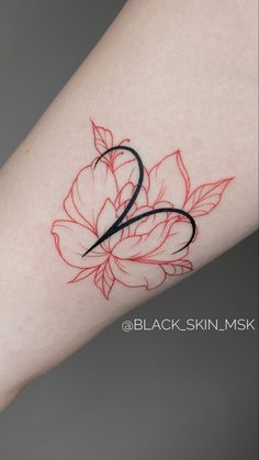 a woman's arm with a red flower tattoo on the left side of her body