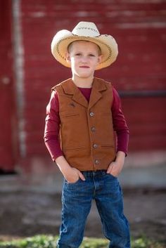 The Youth Bronco Canvas Vest is made from our premium 12 ounce cotton canvas, is durable and strong, just what the upcoming little working rancher and cowboys need. This vest has several unique elements, one being the shoulder western yoke on the front and back of the vest, an open v-neck with lapel and four Wyoming Traders logo buttons. This vest is lined with a polyester satin lining. The Bronco Vest has four front welt pockets, two for your hands and two chest pockets, all lined with a polyes Canvas Vest, Tractor Supply, The Youth, Kids Outerwear, Polyester Satin, Wyoming, Welt Pockets, Tractor, Snug Fit