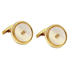 Mother of Pearl round cufflinks handcrafted in 14Kt yellow gold with pave brilliant cut diamond centre. There is no shape more complete and more eternal, than a circle. These Cufflinks are a statement of classiness. They belong to Metalloplasies Collection: Fragments of creativity, representing all different paths Nicofilimon has walked on during his career. Title: Mother of Pearl Cufflinks Collection: Metalloplasies Collection Stone Details: Diamonds 0.032ct, Mother of Pearl Limited edition It Elegant Round Diamond Cufflinks, Round Screw Back Cufflinks For Business, White Gold Polished Round Cufflinks, White Gold Round Cufflinks With Polished Finish, White Gold Cufflinks For Business, Classic Yellow Gold Cufflinks For Anniversary, Classic Yellow Gold Round Cufflinks, Yellow Gold Round Cufflinks For Formal Occasions, Round Screw Back Cufflinks For Anniversary