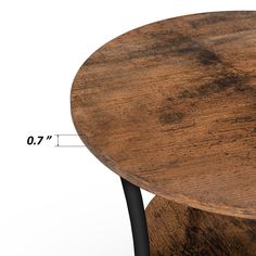 a wooden table with black metal legs and measurements for the top section, showing how high it is