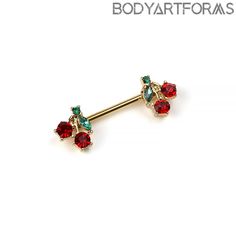 a pair of piercings with red and green stones