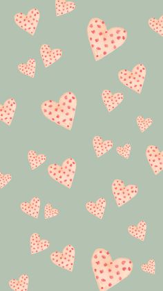 many pink hearts with polka dots on a green background seamless wallpaper pattern for valentine's day