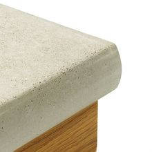 a close up view of a concrete bench