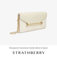 Understated and elegant, our best-selling multrees chain wallet is the perfect day-to-evening companion. Handcrafted in spain, this versatile purse can also be carried as a timeless clutch or transformed into a crossbody bag with its removable gold chain strap. The magnetic closure, decorated with our signature strathberry music bar, keeps your essentials secure and opens to reveal a surprisingly spacious interior - featuring 8 card slots and a zipped pocket with a leather pull. Modern Luxury Clutch With Removable Pouch, Modern Wallet On Chain For Formal Occasions, Modern Formal Wallet On Chain, Elegant Everyday Wallet On Chain With Chain Strap, Luxury Envelope Shoulder Bag With Chain Strap, Timeless Clutch For Everyday Luxury, Timeless Everyday Luxury Clutch Evening Bag, Chic Envelope Wallet On Chain For Everyday, Timeless Rectangular Wallet On Chain For Everyday Use