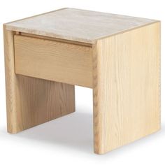 a small wooden stool sitting on top of a white floor