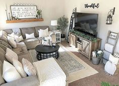 a living room filled with furniture and a flat screen tv