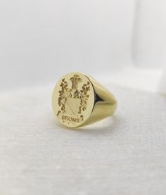 Gold Men Signet Ring - Coat of Arms Ring - Armorial Ring - Family Crest Ring Dimensions: 1.9 x 1.6cm of oval face Band Width: 7mm Your custom signet ring can be made out of 9K Solid Gold, 14K Solid Gold, or 18K Solid Gold. Leave us a message with your desired finish of the band. (Yellow Gold, White Gold, or Rose Gold). ♠ Face can be made in 3D relief or embossed in seal ring type. ♠ We discuss together your ideal jewelry design, in shape, style, and details. ♠ Our customers participate and invol Heirloom Oval Signet Ring With Coat Of Arms, Classic Formal Rings With Coat Of Arms, Heirloom Signet Ring With Coat Of Arms, Formal Yellow Gold Engraved Ring With Coat Of Arms, Ceremonial Engraved Open Signet Ring, Antique Tarnish Resistant Signet Ring For Anniversary, Heirloom Oval Signet Ring For Ceremonial Occasions, Oval Engraved White Gold Ring For Ceremonial Occasions, Oval White Gold Engraved Ring For Ceremonial Occasions