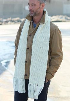 a man wearing a white scarf and jacket