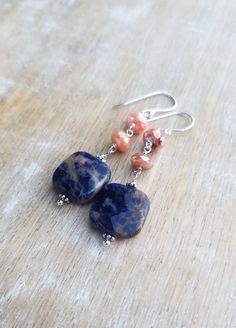 Sodalite Earrings Sterling Silver, Blue and Orange Earrings, Carnelian Earrings, Square Shaped Gemstone Dangle Earrings, Sunset Sodalite Dark indigo blue and orange sunset sodalite gemstones displaying lovely patterns dangle from mystic coated carnelian gemstones and sterling silver ear wires. The total length of the earrings is approximately 2 inches. The square orange sodalite gemstones are about 1/2 inch wide and 1/2 inch tall. They are faceted and polished on both sides. The blue and orange Agate Gemstone Dangle Earrings, Agate Gemstone Bead Dangle Earrings, Agate Dangle Earrings With Ear Wire, Natural Stone Agate Dangle Earrings, Agate Natural Stone Dangle Earrings, Agate Gemstone Drop Earrings, Agate Dangle Earrings With Natural Stones, Dangle Earrings With Natural Agate Stones, Lapis Lazuli Natural Stones Drop Earrings