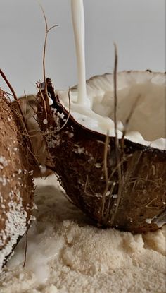 a coconut drink being poured into a bowl