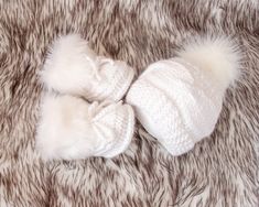 White hand knitted baby fur pom pom hat, Faux fur booties, Baby winter clothes, Baby shower gift, Gender neutral Newborn outfit, Preemie set Every item of this set might be purchased separately as well. These white crochet baby booties and cable knit hat are made with soft acrylic yarn ((super soft, NO itchiness. Great set for baby's first photos and it is perfect for a baby shower or new baby gift. * * * Sizes * * * Preemie Head Circumference: 27 - 30,5 cm / 10.5 - 12 inches Foot length: 7 cm / White Crochet Hat For Winter Gift, Winter White Crochet Hat As Gift, Neutral Newborn Outfit, Baby Winter Clothes, Baby Fur, Fur Pom Pom Hat, Crochet Baby Boots, Baby Uggs, Winter Baby Clothes