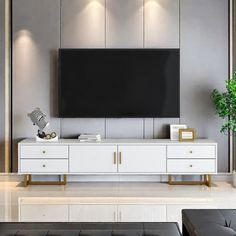 a living room scene with focus on the entertainment center and large screen tv mounted to the wall