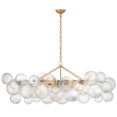 a large chandelier with many glass balls hanging from the ceiling and gold chain