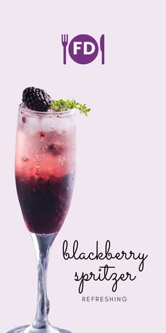 a blackberry spritzer is garnished with fresh blackberries