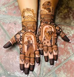 two hands with henna designs on them