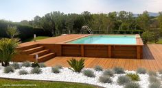 an above ground pool surrounded by wooden decking