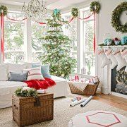 a living room filled with furniture and christmas decorations