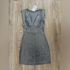 Silver And Grey Metallic Shimmer Dresses For Date Night, Gray Summer Party Dress, Metallic Fitted Sequin Dress For Spring, Metallic Shine Dresses For Party Season, Silver Bodycon Dress For Summer Party, Silver Fitted Mini Dress, Spring Silver Sequin Dress With Shimmer, Elegant Silver Mini Dress For Club, Metallic Shimmer Mini Dress For Spring