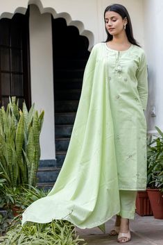 This is 3 piece set.It comes with mirror embellished kurta teamed with trouser and a dupatta to match. 3 Piece Set Fabric-Cotton Color-Green Work-Mirror embellished, embroidered & lace detailing with front & side tassels Kurta Detailing-Calf length kurta with side slits Bottom-Flared Sharara Sleeves-3/4th Sleeves Neck-Round Neck Occasion-Festive wear Washing care-Hand wash Embellished Suit, Peruvian Sweaters, Salwar Suit For Women, Cotton Salwar Suit, Kurta Pants, Suit Combinations, Pista Green, Mirror Embroidery, Long Kurtis