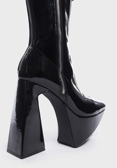 got you stuck in another dimension. These angular ankle boots have a patent vegan leather construction, an adjustable side zip and a decorative zip at top, pointed toes, chunky platforms, and flared block heels. Party High Cut Chunky Platform Boots, Party High-cut Chunky Platform Boots, Party High-cut Platform Boots With Chunky Platform, Edgy High Heel Platform Boots With Zipper Closure, Party Patent Leather Boots With Zipper Closure, Patent Leather Party Boots With Zipper Closure, Punk Style Platform Boots In Patent Leather, Edgy High Cut Platform Boots For Party, Edgy High-cut Platform Boots For Parties