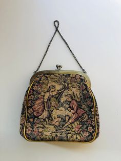 Vintage Handbag JR Julius Resnick Tapestry Midcentury Evening Bag Enchanting Courting Scene I Ship Globally One of my favorites from a group of antique handbags I recently acquired.   The courting scene on this tapestry bag is just so enchanting.  Other things I love about this bag are the gold piping and the overall condition of this bag.  This bag is quite solid and could be used for an evening out, if handled with care, of course!  Unfortunately, it did not pass my cell phone test, but my iph Formal Embroidered Tapestry Bag, Vintage Tapestry Pouch Bag, Vintage Tapestry Handmade Bags, Antique Tapestry Evening Bag, Vintage Handmade Tapestry Bag, Antique Tapestry Bags For Everyday, Vintage Embroidered Tapestry Shoulder Bag, Vintage Tapestry Travel Bag, Vintage Tapestry Shoulder Bag For Travel