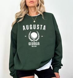 Masters Golf tournament sweatshirt, Classic Augusta Georgia golf tournament Sweatshirt, Augusta Sweatshirt, Augusta Georgia Crewneck, Golf Sweatshirt for women, golfing sweatshirt for men,Distressed Augusta Sweatshirt, Golf Shirt, Trendy Sweatshirt for women, golfer mom, golf mom, golfer gifts for women,Unisex Sweatshirt, Augusta National Masters Golf Club Inspired Queen Crewneck Sweatshirt for Women,Masters Golf Sweatshirt for women,Golf Mom,Golf,Golf Shirt This sweatshirt made from premium, soft materials, it's perfect for autumn or casual outings. Our unisex sizing tshirt is comfortable enough to wear all day. It's a classic fit sweater made with air-jet spun yarn for a soft feel. The ring-spun cotton blend make them ultra comfortable and long lasting for years to come.  📏 PRODUCT & SI Sporty Long Sleeve Sweatshirt For Golf, Sporty Letter Print Sweatshirt For Golf, Sporty Crew Neck Golf Sweatshirt, Sporty Crew Neck Sweatshirt For Golf, Green Crew Neck Top For Golf, The Masters Golf, Golfer Gifts, Masters Golf Tournament, Golf Sweatshirt