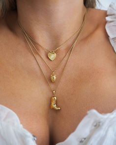 This vintage-inspired strawberry charm necklace is the perfect accessory for a fun, feminine look. Wear the delicate piece alone or layer with your favorite necklaces. 14k gold plated + palladium plating with brass base Chain measures 17" + 2" extender Spring clasp Charm measures approx 10mm by 8.5mm Protective coating, water resistant Heirloom Style Brass Necklace, Tarnish Resistant, Heirloom Brass Necklace Tarnish Resistant, Dainty Gold-tone Brass Necklaces, Dainty Gold-tone Charm Necklace With Round Pendant, Dainty Gold-tone Brass Necklace, Dainty Yellow Gold Brass Charm Necklace, Elegant Brass Necklace With Vintage Charm, Dainty Gold Plated Chain Necklace, Gold Plated Vintage Charm Necklaces