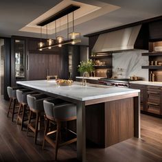 a large kitchen with an island and lots of stools in front of the counter