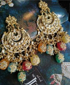 Product Description: * Traditional Earrings/kundan chandbalis/Chandbalis/sabyasachi Earrings/Sabyasachi chandbalis/Kundan earrings/Kundan meena earrings/indian * The base metal color is Gold tone studded with kundan along with beads work on it. * This Jewelry set would add more charms to your beautiful jewelry collection and would surely bring lots of compliments . * Note:- This is an artificial Jewelry Set. * Care Instructions: Keep it dust-free & dirt free in a plastic pouch. Remember to apply Sabyasachi Earrings, Temple Work, Kundan Chandbali, Earrings Kundan, Jewelry Traditional, Kundan Jewellery Bridal, Jewelry Kundan, Kundan Jewelry, Bangle Gold