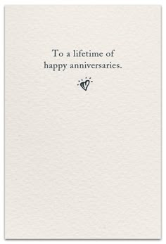 a white card with the words to a life time of happy annivers on it