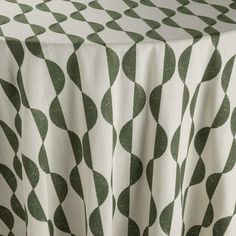 a green and white table cloth with circles on it