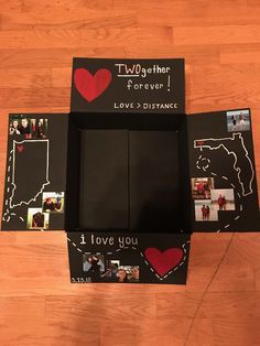 two boxes with pictures and hearts on them sitting on a wooden floor next to each other