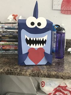 a paper bag with a monster face on it sitting on top of a kitchen counter