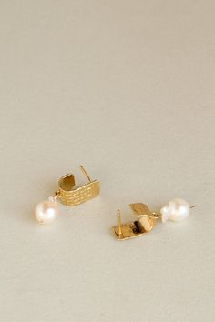 A comfortable yet unexpected everyday stud earring. A single baroque pearl is suspended from a stately ear cuff, cast from antique decorative sheeting. The cuff features an intricate stamp pattern of diamonds, contrasting with the lustrous and organic simplicity of the pearl: a natural harmony of two forms. This style finds its origins in our Maretta earrings. Pictured here with the Sunrise Studs. Materials Gold vermeil earring with baroque pearl. The metals we use are recycled. Click here to ex Stamp Pattern, Everyday Earrings Studs, Everyday Elegance, The Sunrise, Cuff Earrings, Pearl Drop, Baroque Pearls, Stud Earring, Gold Vermeil