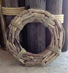 a wreath made out of sticks and rope