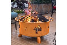 a fire pit sitting on top of a wooden floor