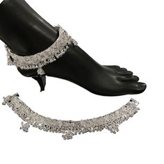 Description This pair of bridal Pajeb anklets is crafted from 80.0% silver purity and offers superior quality and hardness with a moonlight finish. Cluster beads soundless bells perfect for those looking to add a luxurious touch to their collection. Handcrafted and not made of 80%, this silver anklet pair with cluster of beads, color Meena, and light bells offers excellent hardness, superior quality, and a moonlight finish. Price is per pair. Anklet pair are Hallmarked i.e., Silver purity certif Traditional Silver Anklets For Festive Occasions, Traditional Silver Toe Ring Anklets, Traditional Silver Beaded Wedding Anklets, Adjustable Silver Anklets For Festive Season, Festive Adjustable Silver Anklets, Festive Silver Adjustable Anklets, Silver Tilla Anklets For Festive Occasions, Traditional White Anklets With Silver Beads, Festive Silver Tilla Anklets