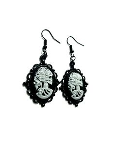 Oval shaped cameo with skeleton cameo lady set in an elegant black cameo metal base. Jett black French hook earring loops, presented in organza drawstring bag Follow @helloween_13 on Instagram Steampunk Black Jewelry For Halloween, Black Steampunk Jewelry For Halloween, Steampunk Black Halloween Jewelry, Halloween Black Steampunk Jewelry, Gothic Skull Earrings, Vintage Black Skull Jewelry, Gothic Black Cameo Jewelry, Victorian Zombie, Vampire Oc