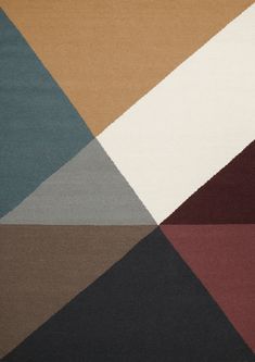 a multicolored area rug with an abstract design