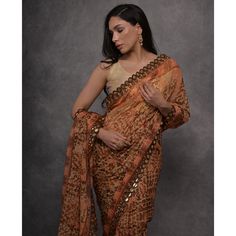 Peach colored saree is made from georgette fabric which is highlighted with beautiful printed mirror work as shown. Comes along with unstitched heavy satin gota blouse piece which you can customise as per your design/style. Occasion - You can wear this saree for casual and daily wear. Note:- the actual product may differ slightly in color and design from the one illustrated in the images when compared with computer or mobile screen. Measurements: Saree : Georgette : 5.5 Mtrs Blouse : Georgette : Peach Color Saree, Printed Mirror, Georgette Material, Glamorous Party, Beautiful Heels, Wear Saree, Georgette Saree, Georgette Fabric, Mirror Work